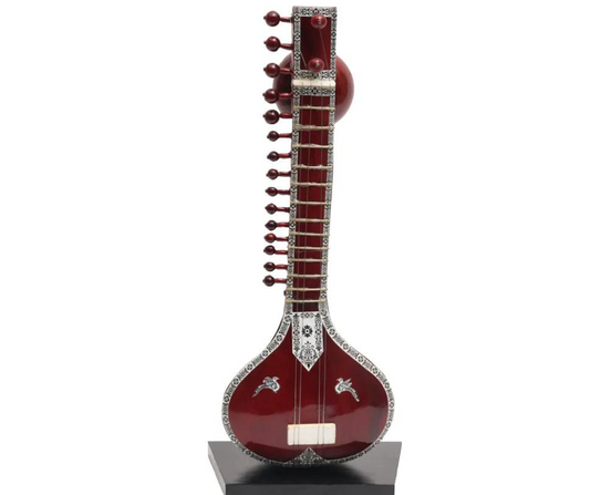 "Miniature Sitar Crafted from Rich Brown Wood: A Musical Marvel"