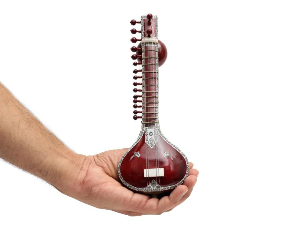 "Miniature Sitar Crafted from Rich Brown Wood: A Musical Marvel"